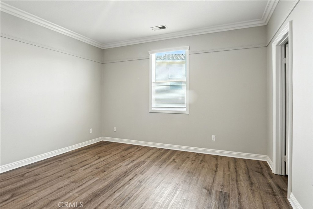 18338 Lakepointe Drive Riverside, CA 92503 - Photo 30 of 40 wooden floor in an empty room with a window