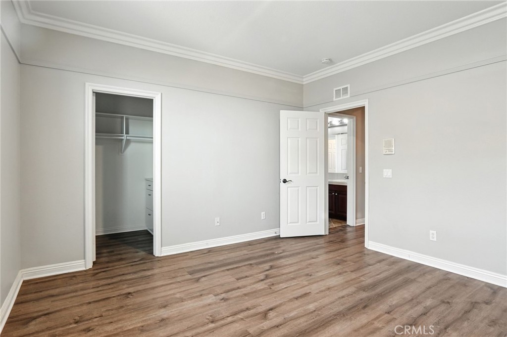 18338 Lakepointe Drive Riverside, CA 92503 - Photo 31 of 40 a view of an empty room with wooden floor