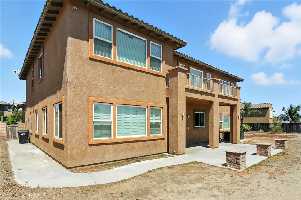 18338 Lakepointe Drive Riverside, CA 92503 - Photo 39 of 40 a view of a house with a barbeque and wooden stairs
