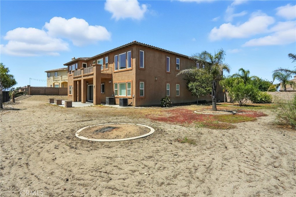 18338 Lakepointe Drive Riverside, CA 92503 - Photo 40 of 40 a backyard of a house with yard and garage