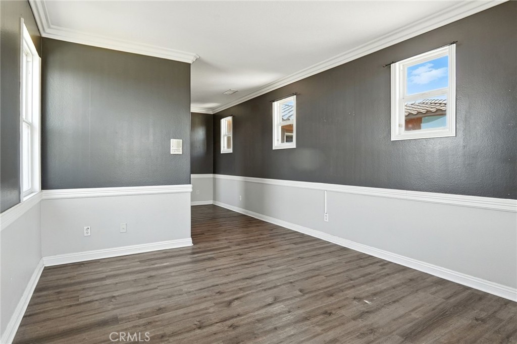 18338 Lakepointe Drive Riverside, CA 92503 - Photo 6 of 40 a view of an empty room with wooden floor