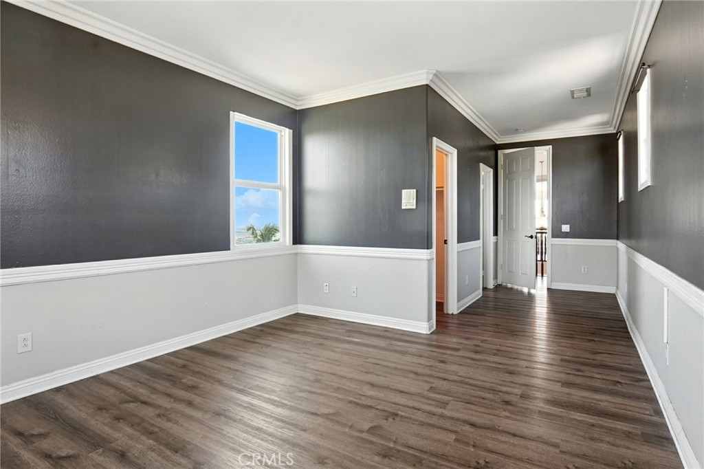 18338 Lakepointe Drive Riverside, CA 92503 - Photo 7 of 40 a view of an empty room with wooden floor