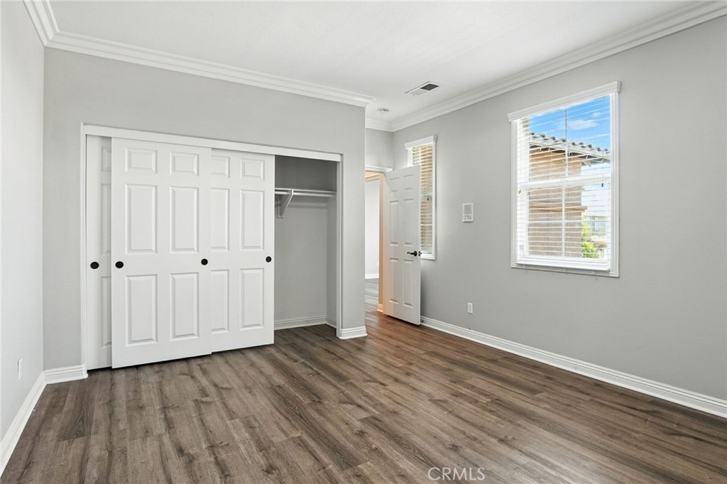 18338 Lakepointe Drive Riverside, CA 92503 - Photo 10 of 40 a view of an empty room with wooden floor