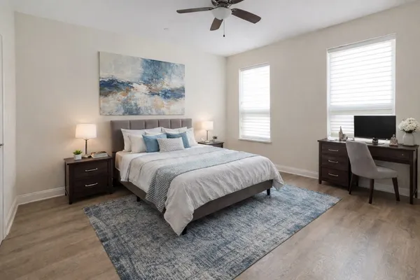 a bedroom with a bed and a couch