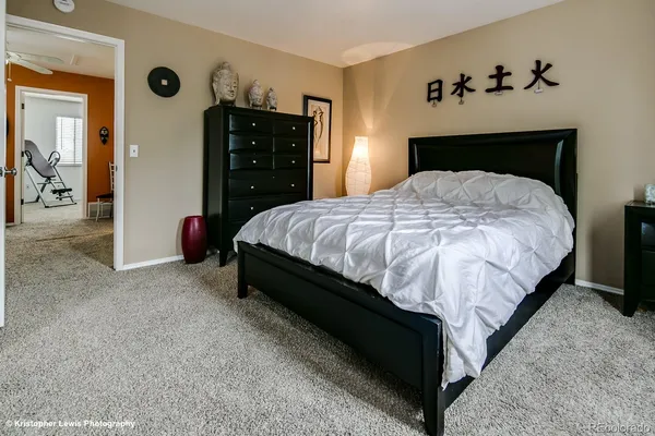 a bedroom with a bed and a closet