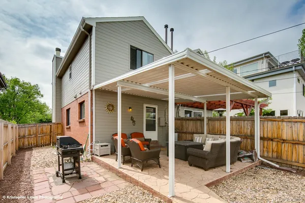 a patio with table and chairs