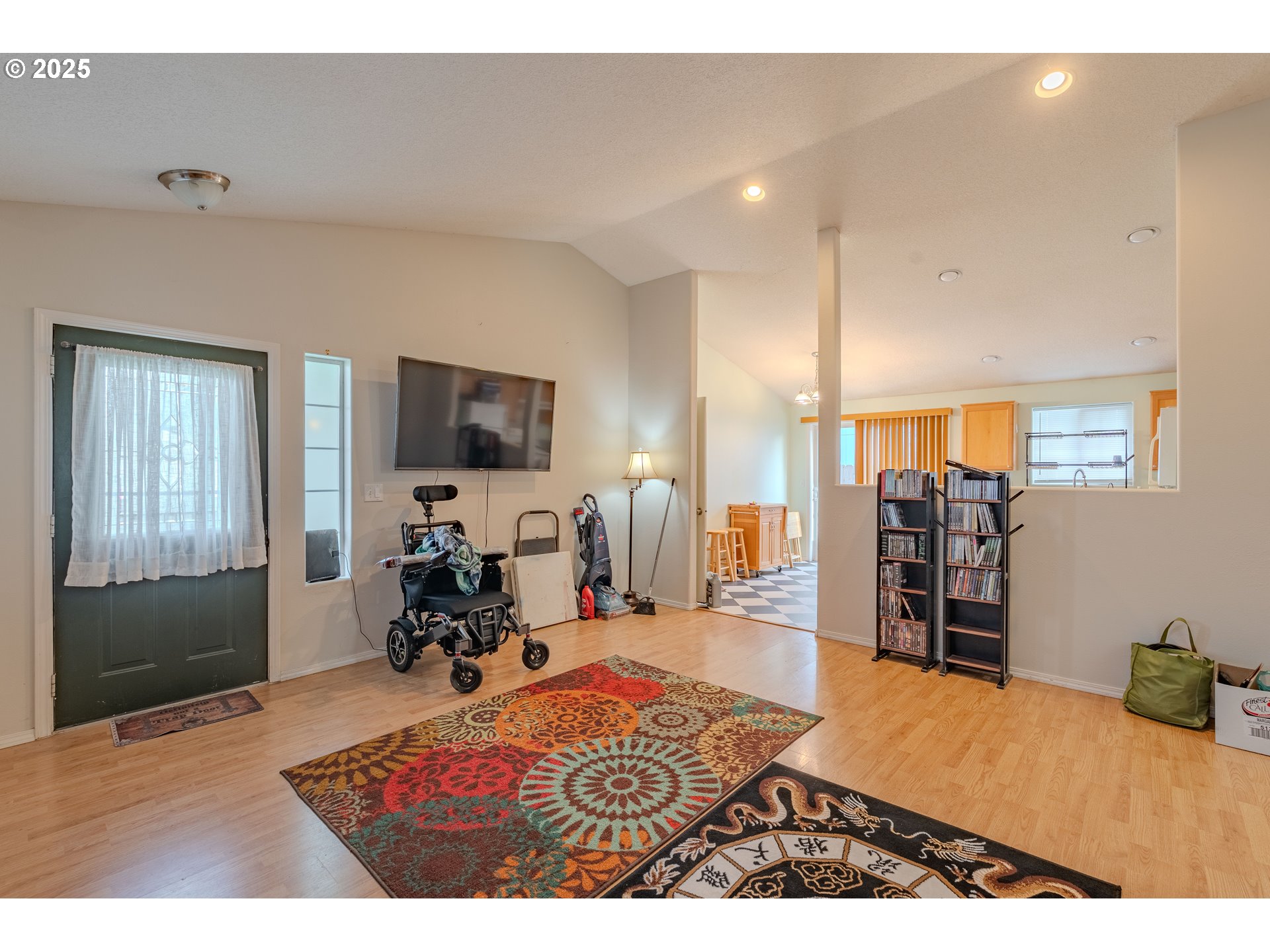 13307 Northeast 77th Street Vancouver, WA 98682 - Photo 2 of 33 a living room with furniture and a flat screen tv