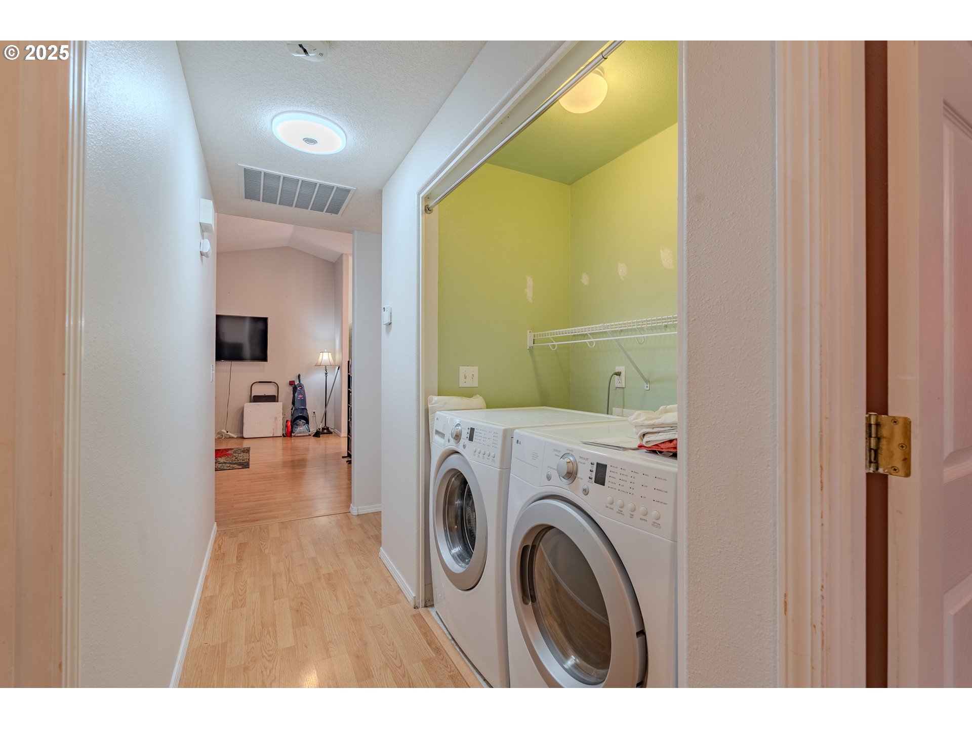 13307 Northeast 77th Street Vancouver, WA 98682 - Photo 10 of 33 a view of a hallway with washer and dryer