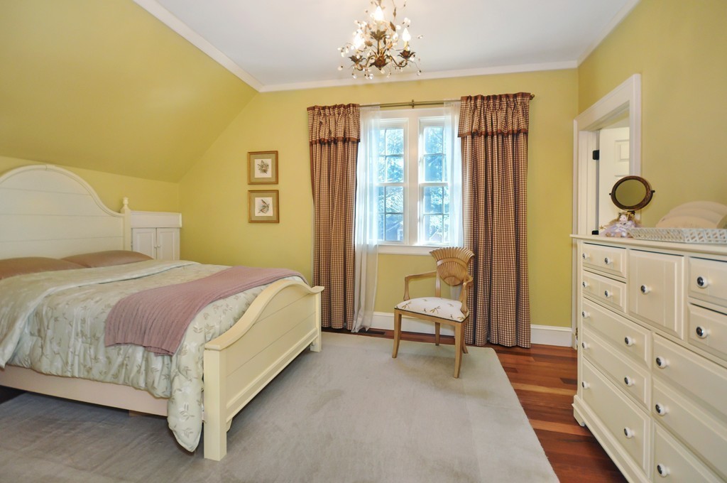 315 Garfield Road Concord, MA 01742 - Photo 19 of 21 a bedroom with a bed and wooden floor