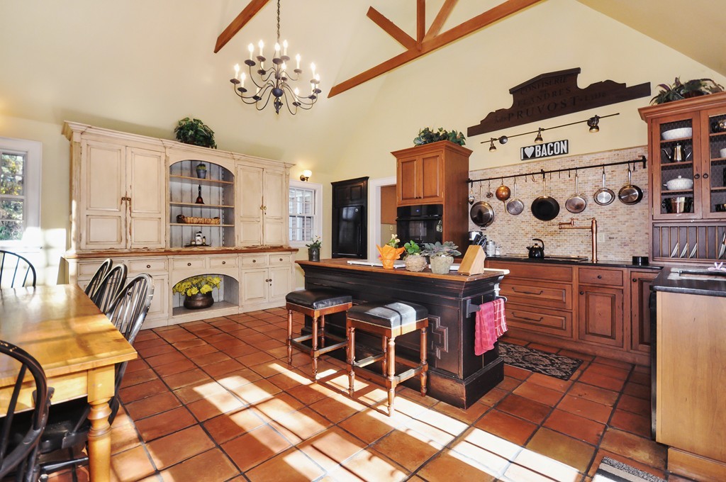 315 Garfield Road Concord, MA 01742 - Photo 3 of 21 a living room with kitchen island furniture and a chandelier