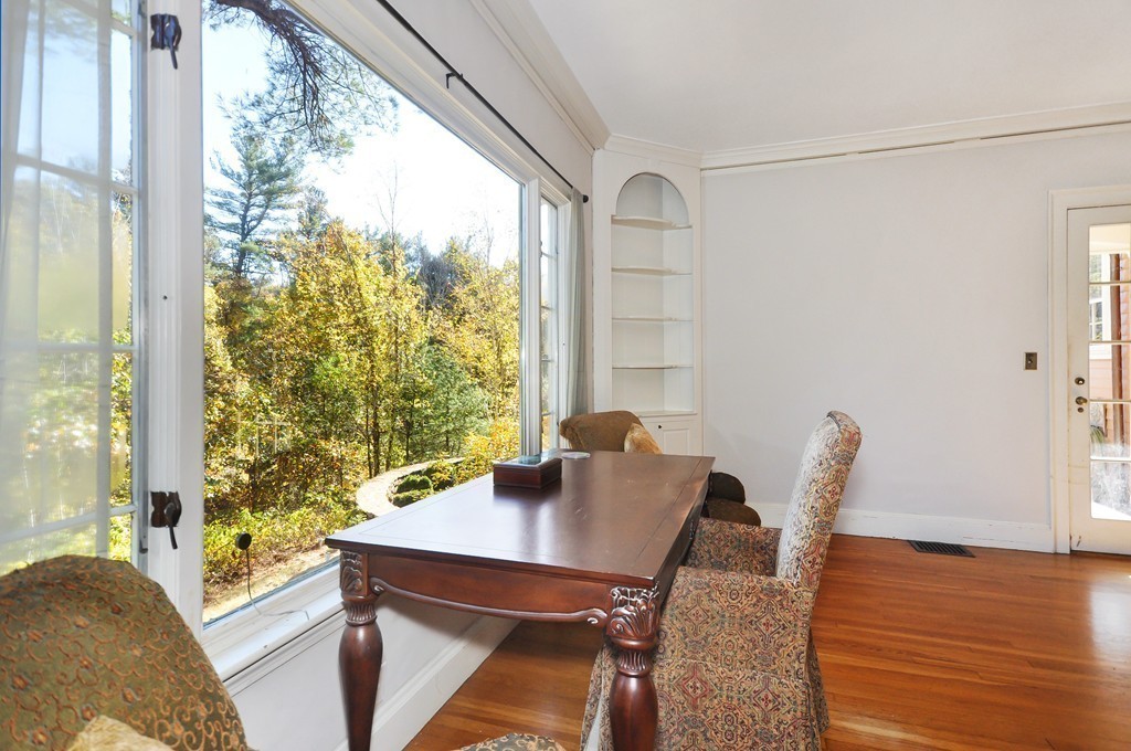 315 Garfield Road Concord, MA 01742 - Photo 8 of 21 a view of a dining room with furniture and wooden floor