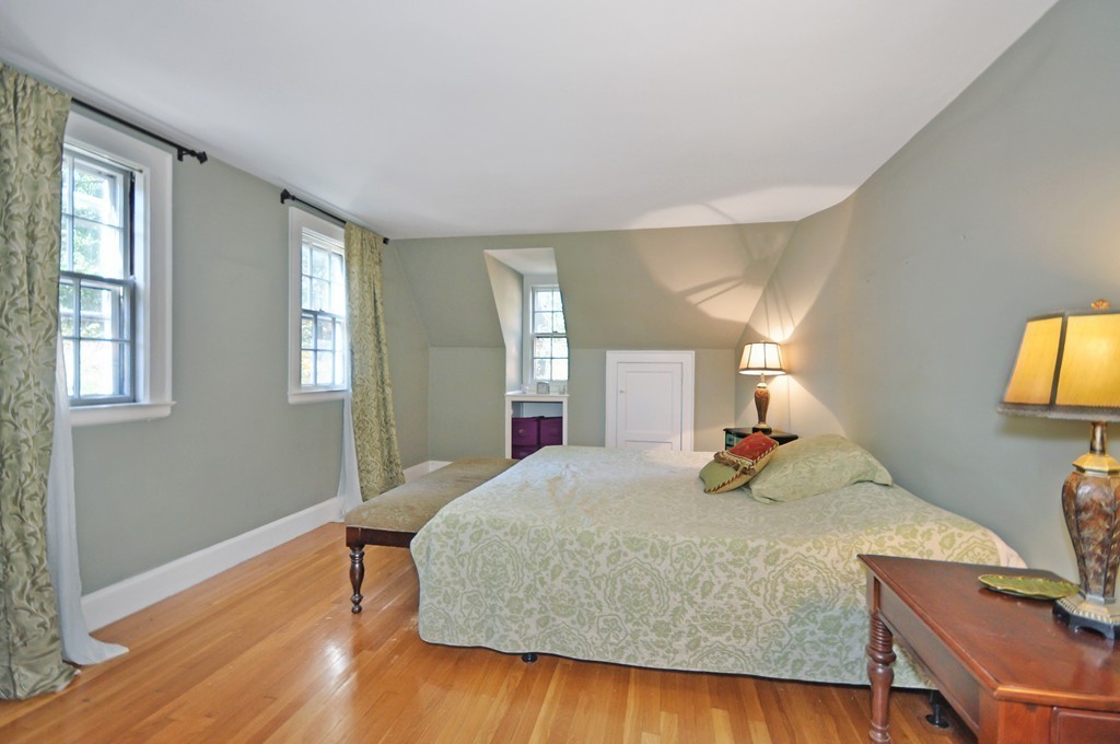 315 Garfield Road Concord, MA 01742 - Photo 10 of 21 a bedroom with a bed and wooden floor
