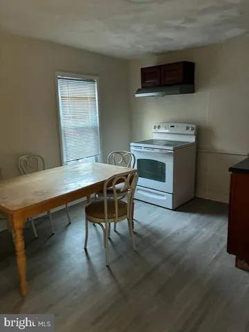 a kitchen with a stove and a microwave