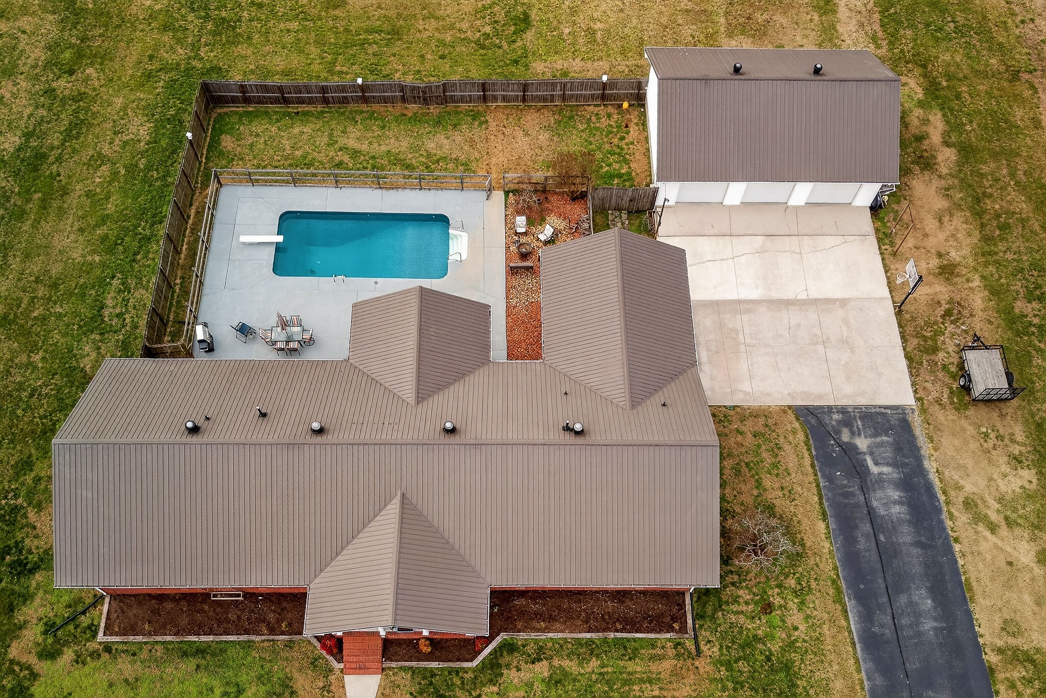 597 Game Ridge Road Smithville, TN 37166 - Photo 2 of 45 an aerial view of a house with swimming pool and outdoor seating