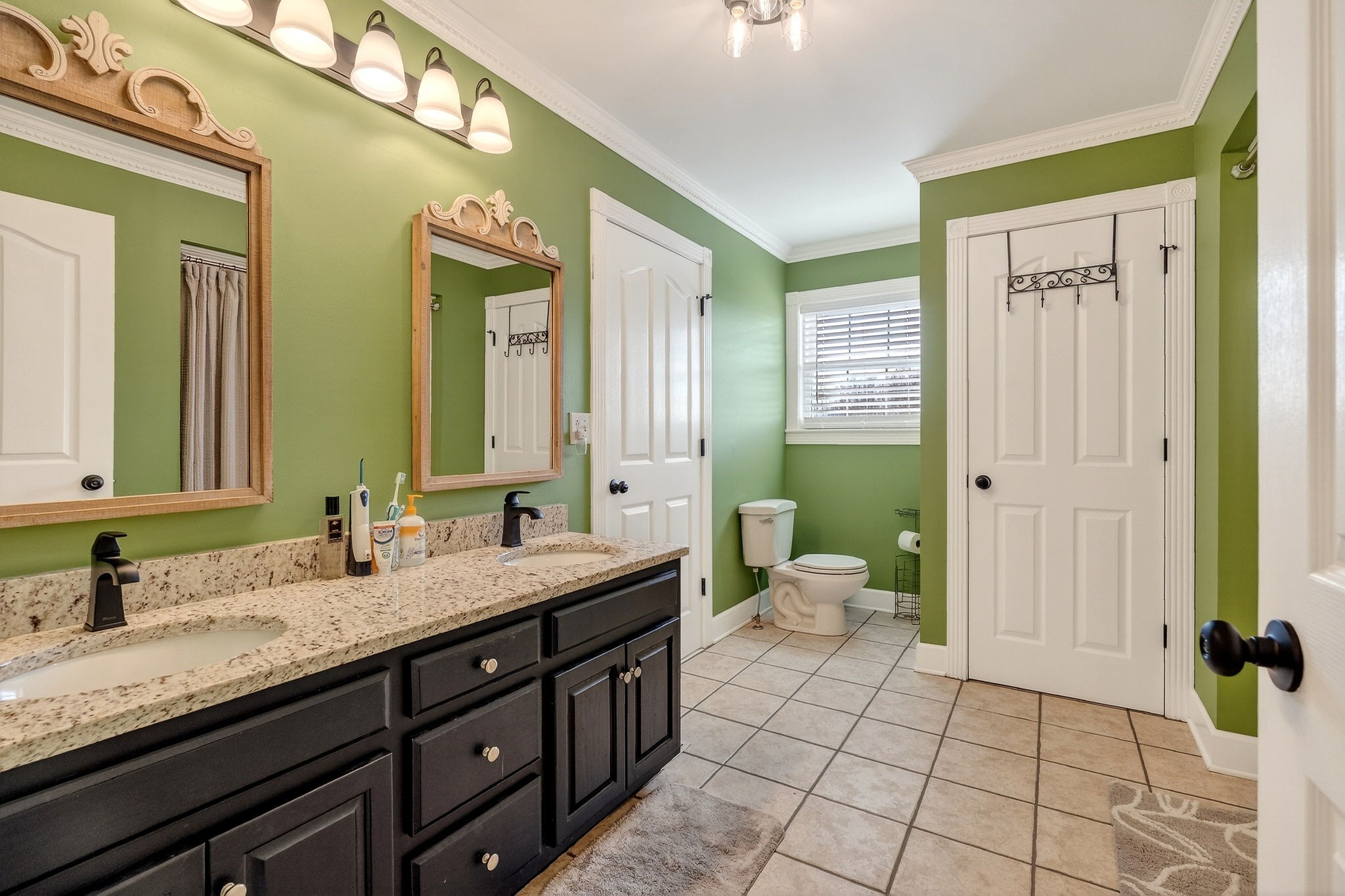 597 Game Ridge Road Smithville, TN 37166 - Photo 32 of 45 a bathroom with a granite countertop sink mirror and a toilet