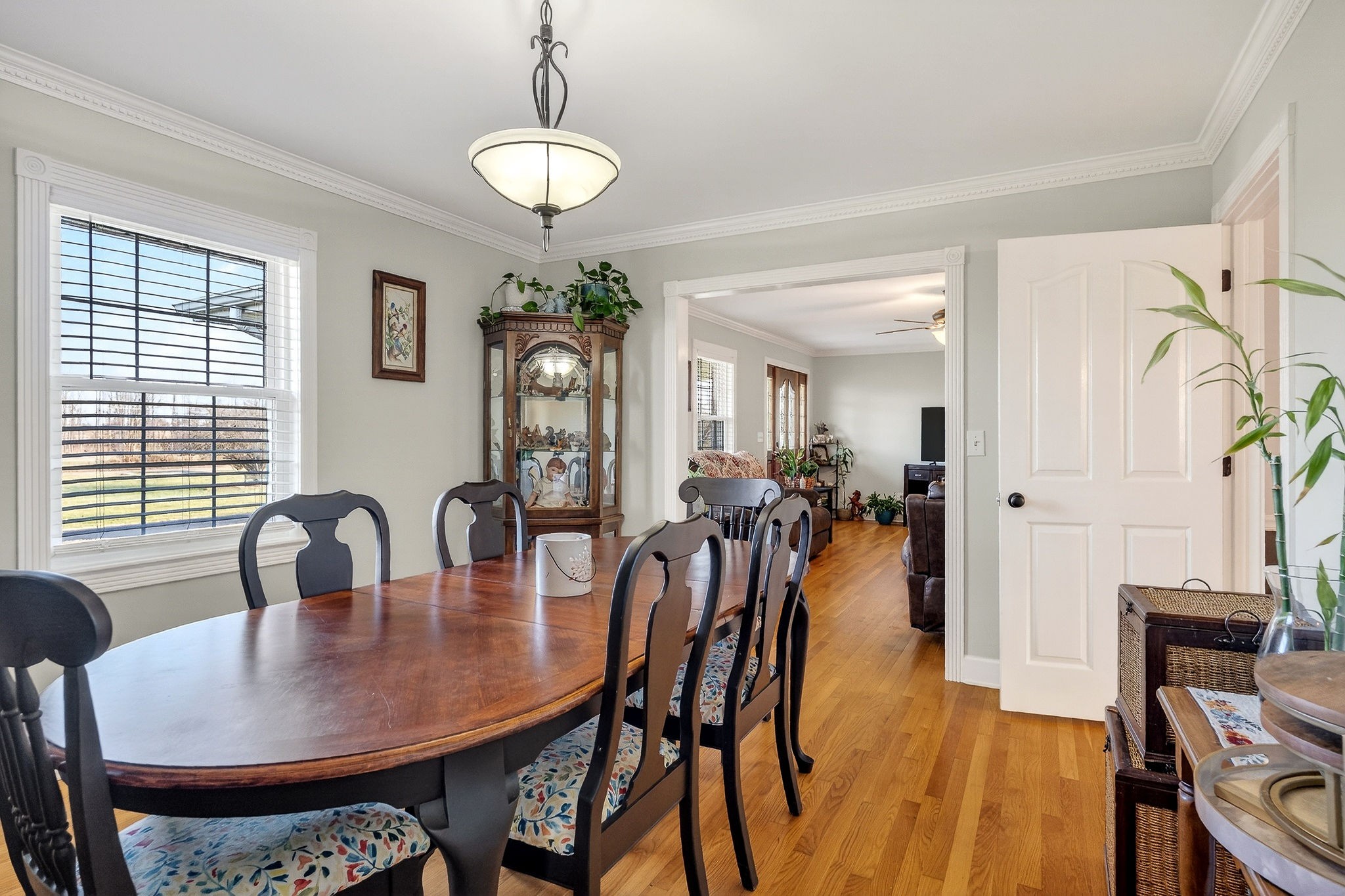 597 Game Ridge Road Smithville, TN 37166 - Photo 9 of 45 a view of a dining room and livingroom with furniture wooden floor a chandelier