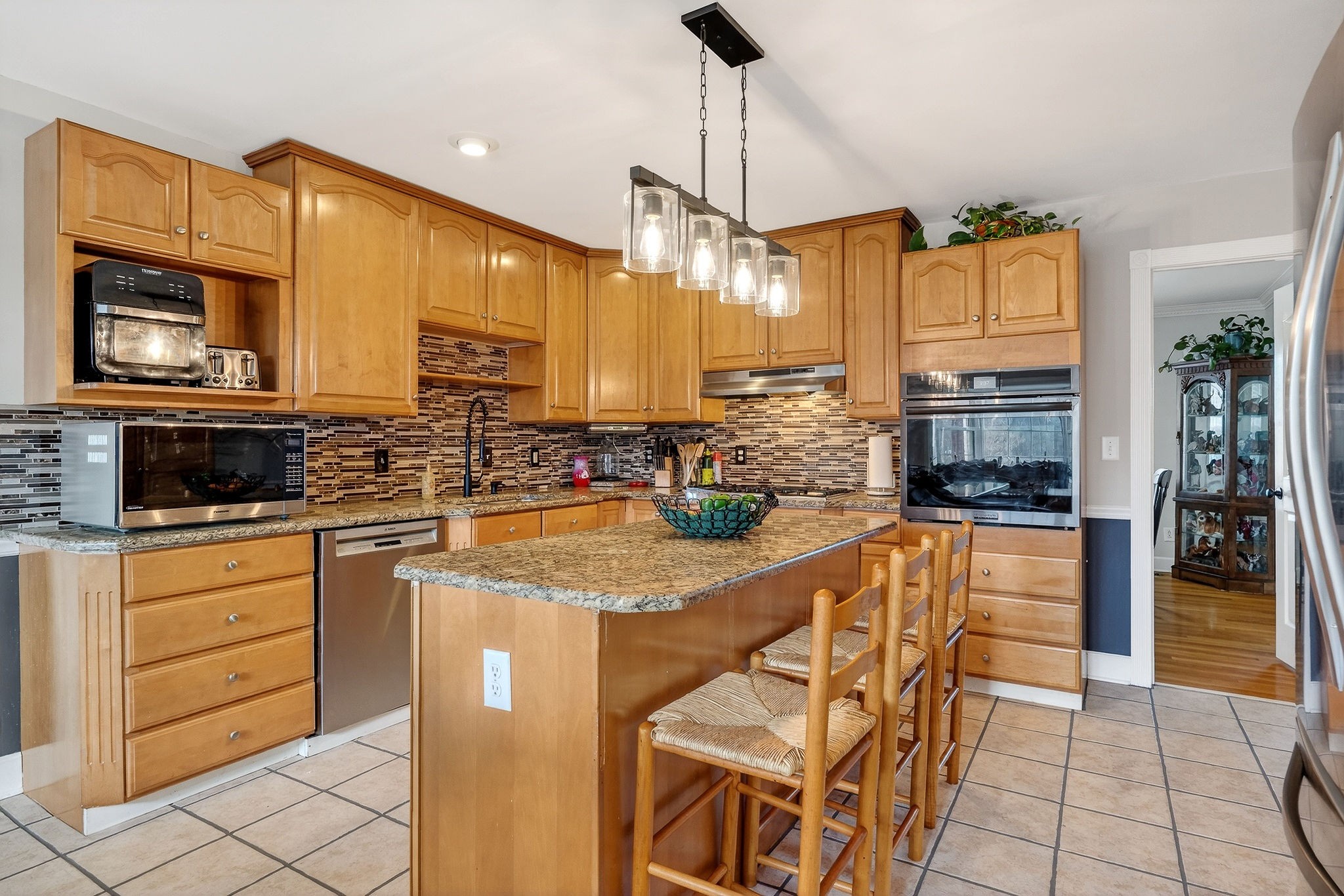 597 Game Ridge Road Smithville, TN 37166 - Photo 10 of 45 a kitchen with stainless steel appliances granite countertop a stove a sink and a microwave
