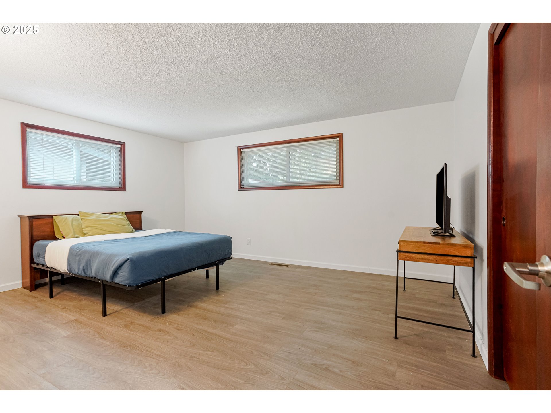 4627 2nd Way Southeast Salem, OR 97302 - Photo 15 of 48 a bedroom with a bed a rug and a painting on the wall