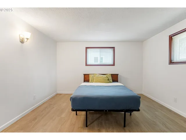 a bedroom with a bed and a table in it