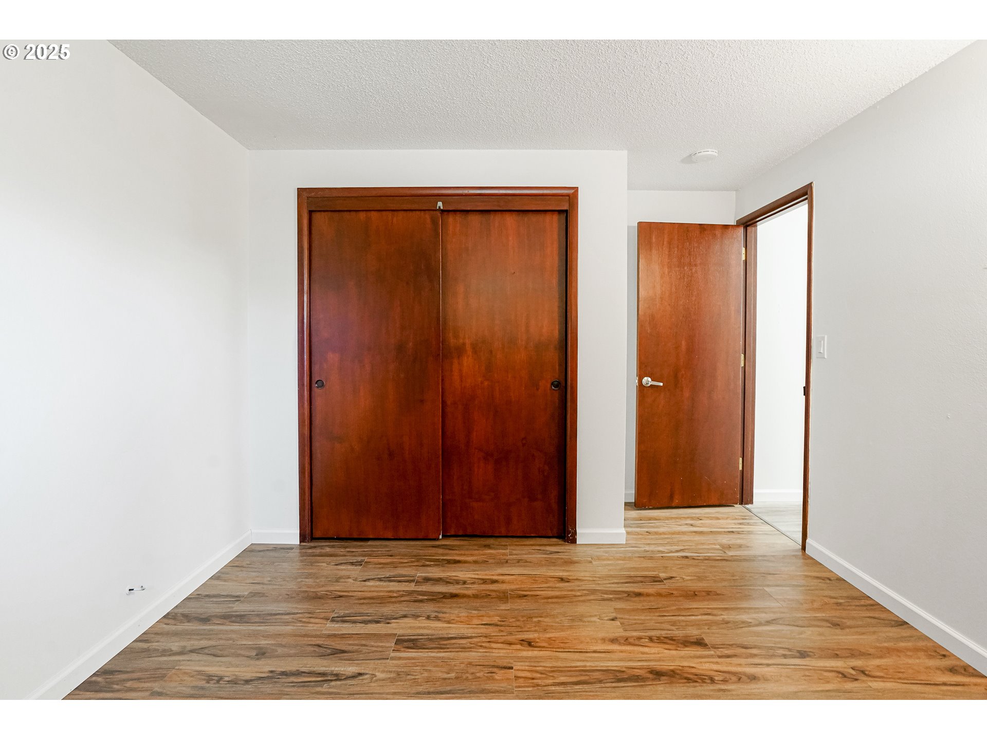 4627 2nd Way Southeast Salem, OR 97302 - Photo 20 of 48 a view of an empty room with wooden floor