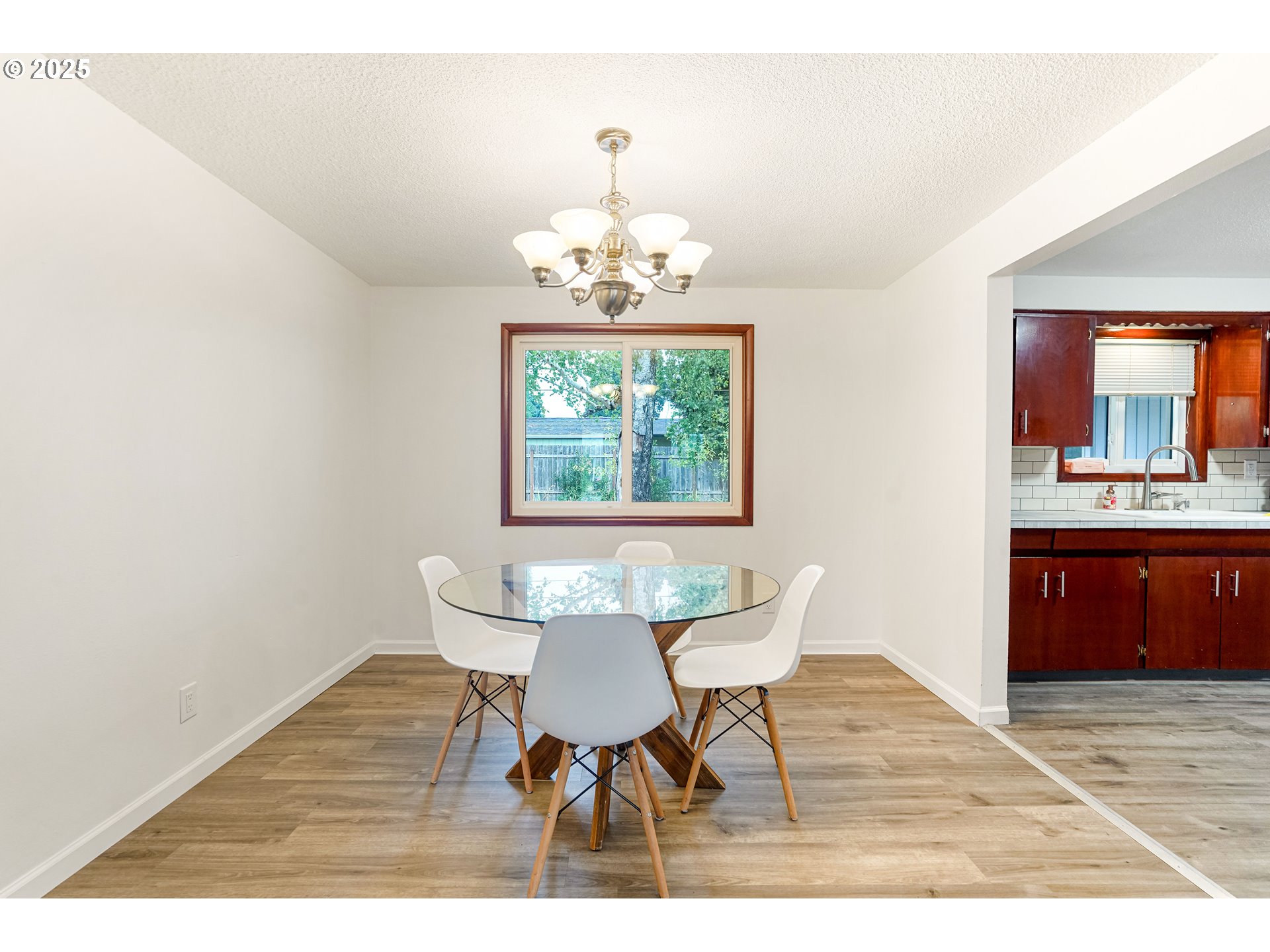 4627 2nd Way Southeast Salem, OR 97302 - Photo 21 of 48 a dining room with a wooden table and chairs