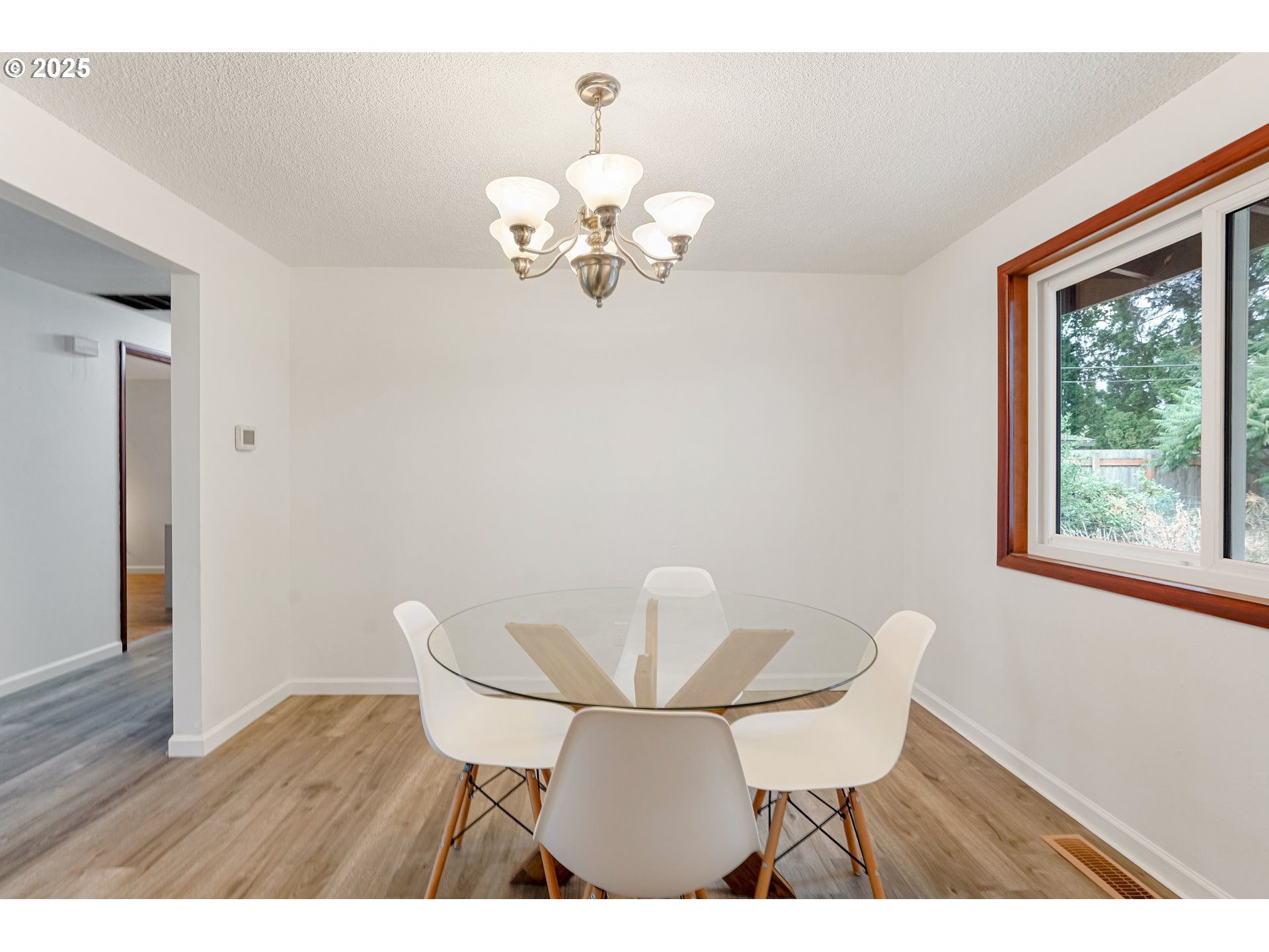 4627 2nd Way Southeast Salem, OR 97302 - Photo 22 of 48 a view of a dining room with furniture a chandelier and wooden floor