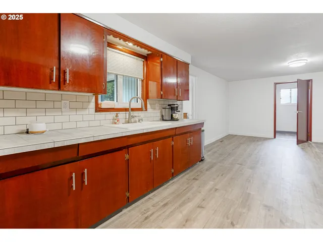 a bathroom with a sink double vanity granite and a mirror