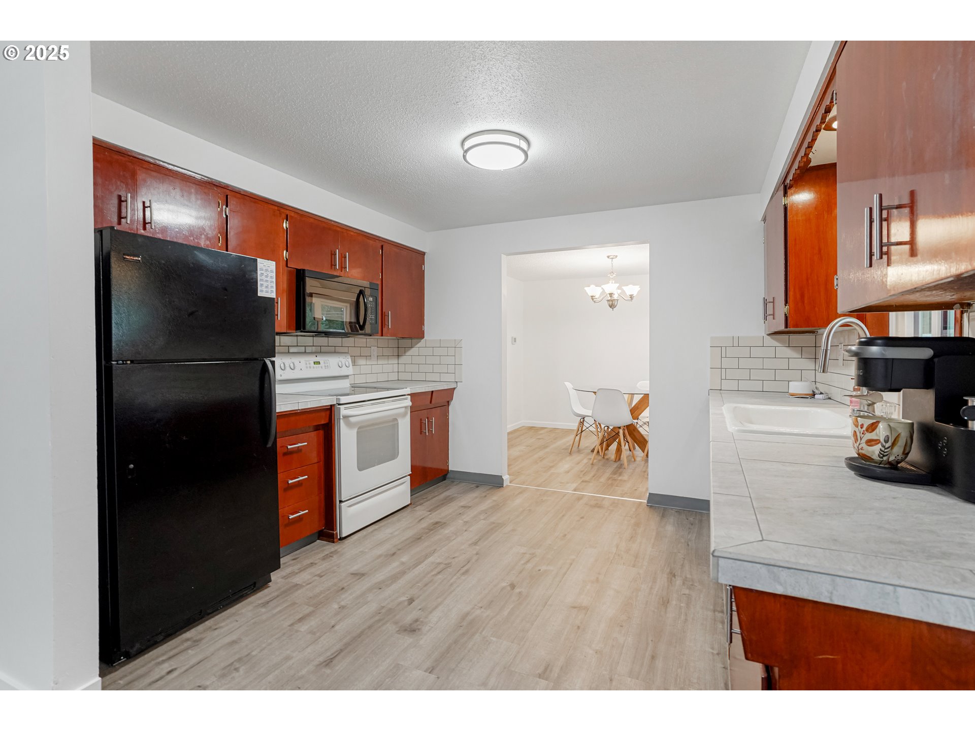 4627 2nd Way Southeast Salem, OR 97302 - Photo 25 of 48 a kitchen with stainless steel appliances granite countertop a refrigerator and a stove top oven