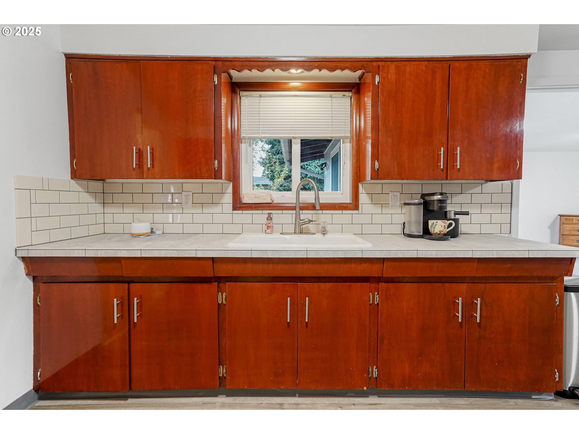 4627 2nd Way Southeast Salem, OR 97302 - Photo 27 of 48 a kitchen with a sink a window and cabinets