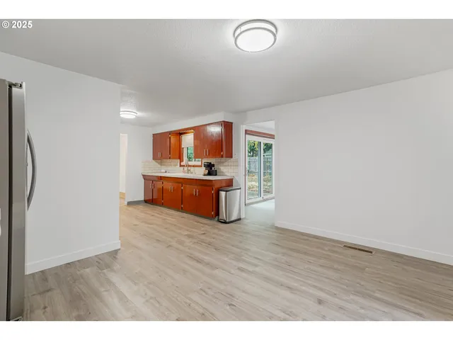 a view of kitchen with wooden floor