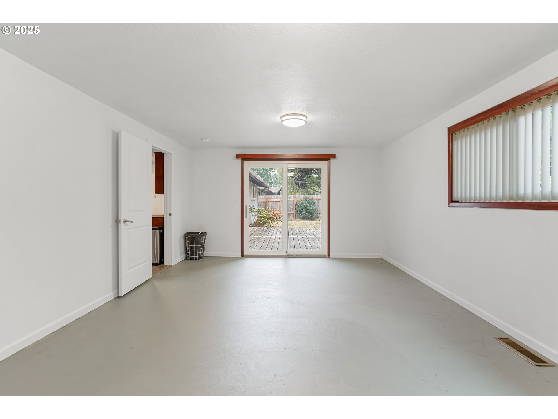 4627 2nd Way Southeast Salem, OR 97302 - Photo 36 of 48 a view of a big room with windows and chandelier fan