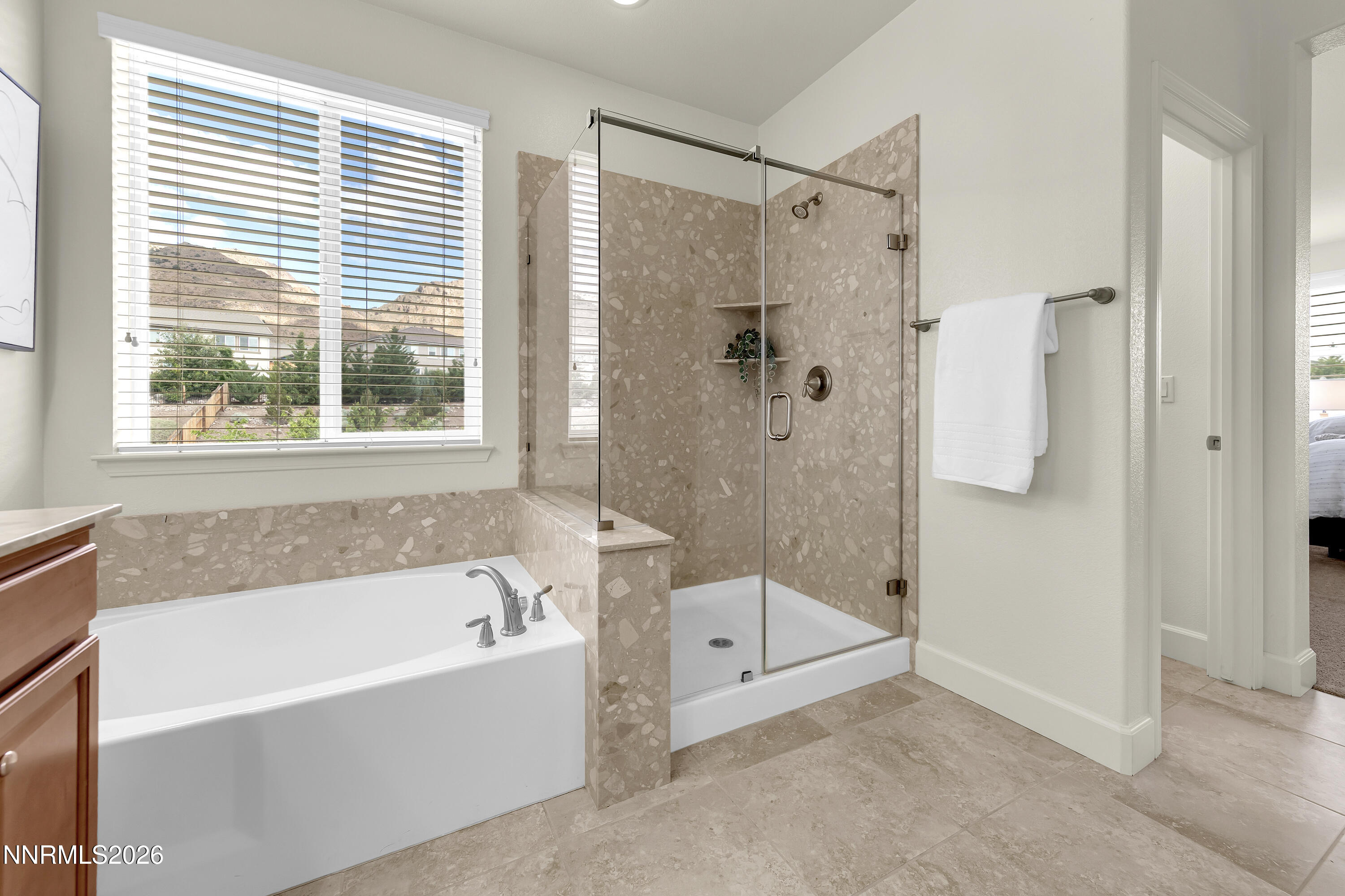 10150 Barrel Racer Drive Reno, NV 89521 - Photo 59 of 64 a bathroom with a bathtub and a shower