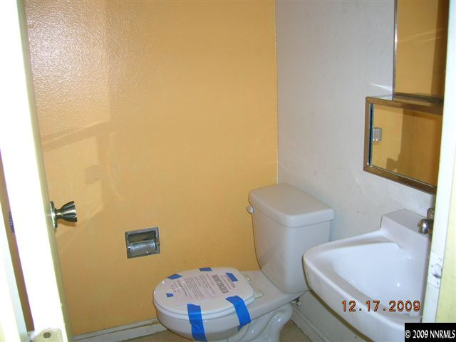 1402 East 9th Street, Unit 8 Reno, NV 89512 - Photo 9 of 9 a bathroom with a sink and a mirror