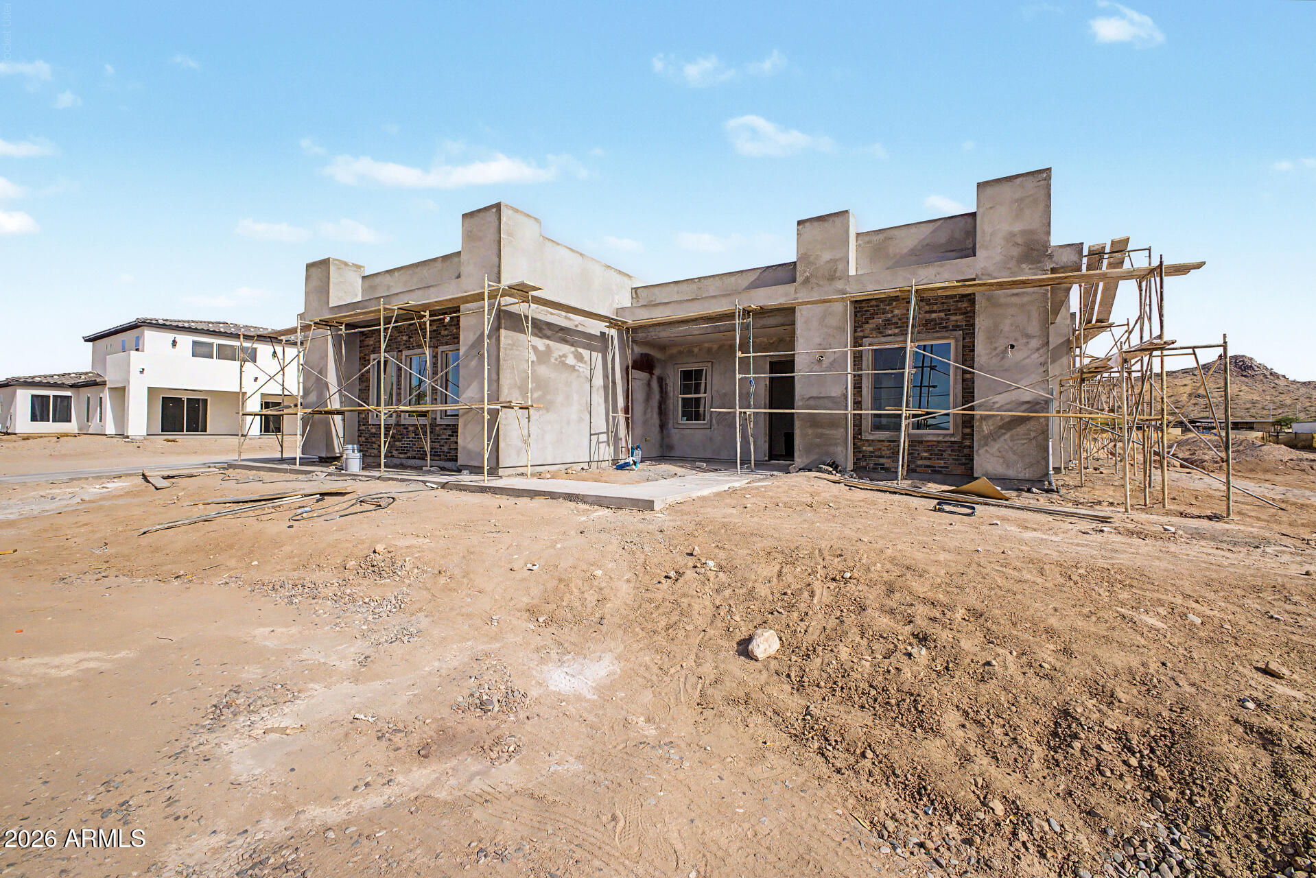 18815 West Arlington Road Buckeye, AZ 85326 - Photo 6 of 56 a front view of a building with a outdoor space