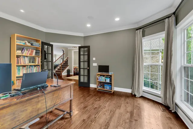 a view of a livingroom with furniture and a flat screen tv