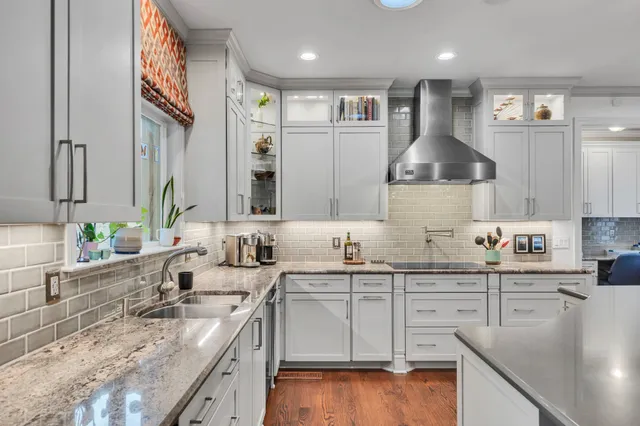 a kitchen with a sink stove and cabinets