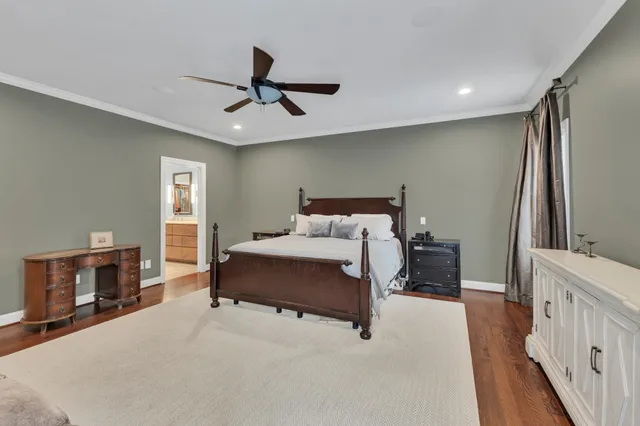 a spacious bedroom with a bed and a couch