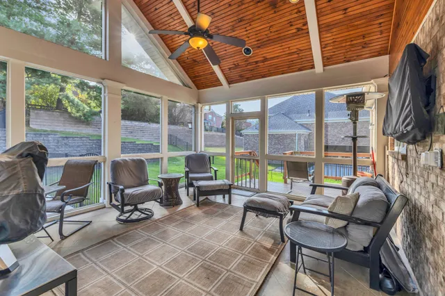 a view of a wooden deck besides a house