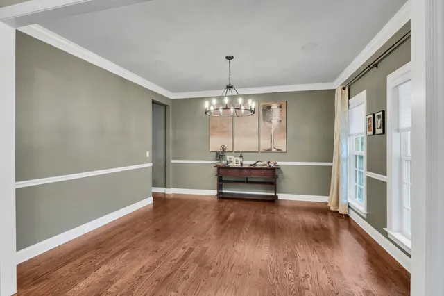 a view of dining room with furniture window and wooden floor
