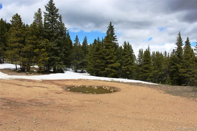 a view of a backyard of the house