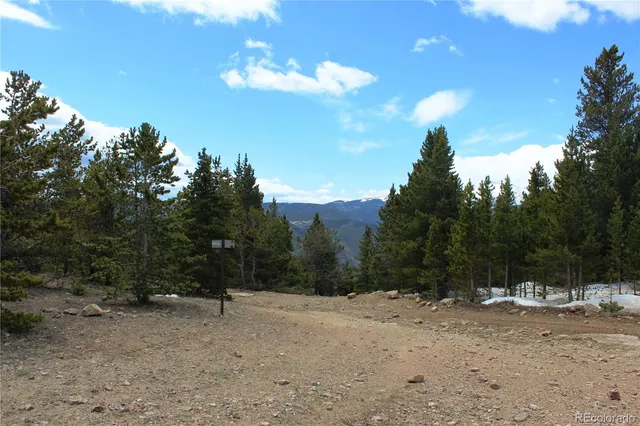 a view of dirt yard with mountain view