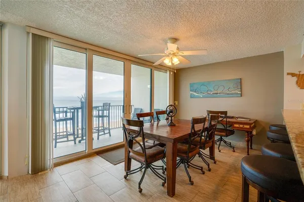 a view of a dining room with furniture window and outside view