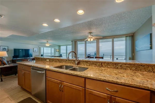 a kitchen with sink and cabinets