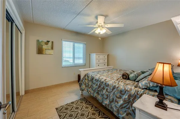 a bathroom with a granite countertop sink mirror and bathtub