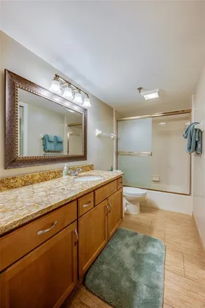 a view of house with backyard and parking