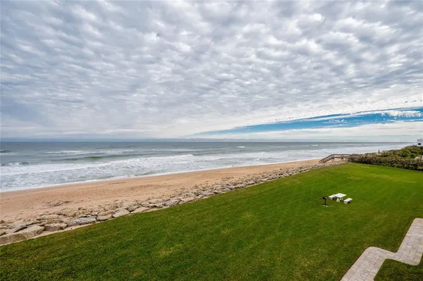a view of a swimming pool with a yard
