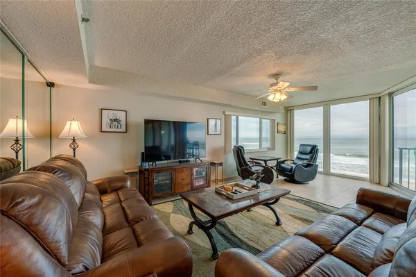 a living room with furniture and a large window