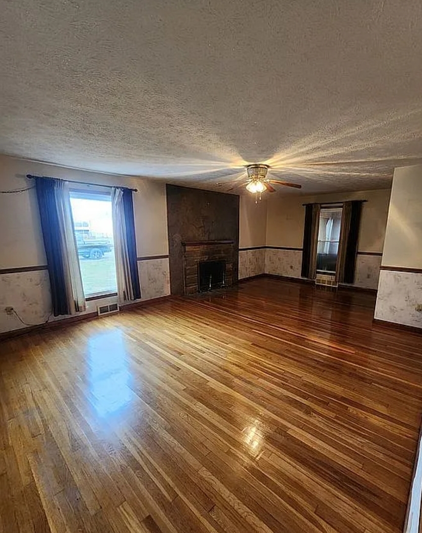 1100 John Stelle Road McLeansboro, IL 62859 - Photo 12 of 20 a view of empty room with wooden floor
