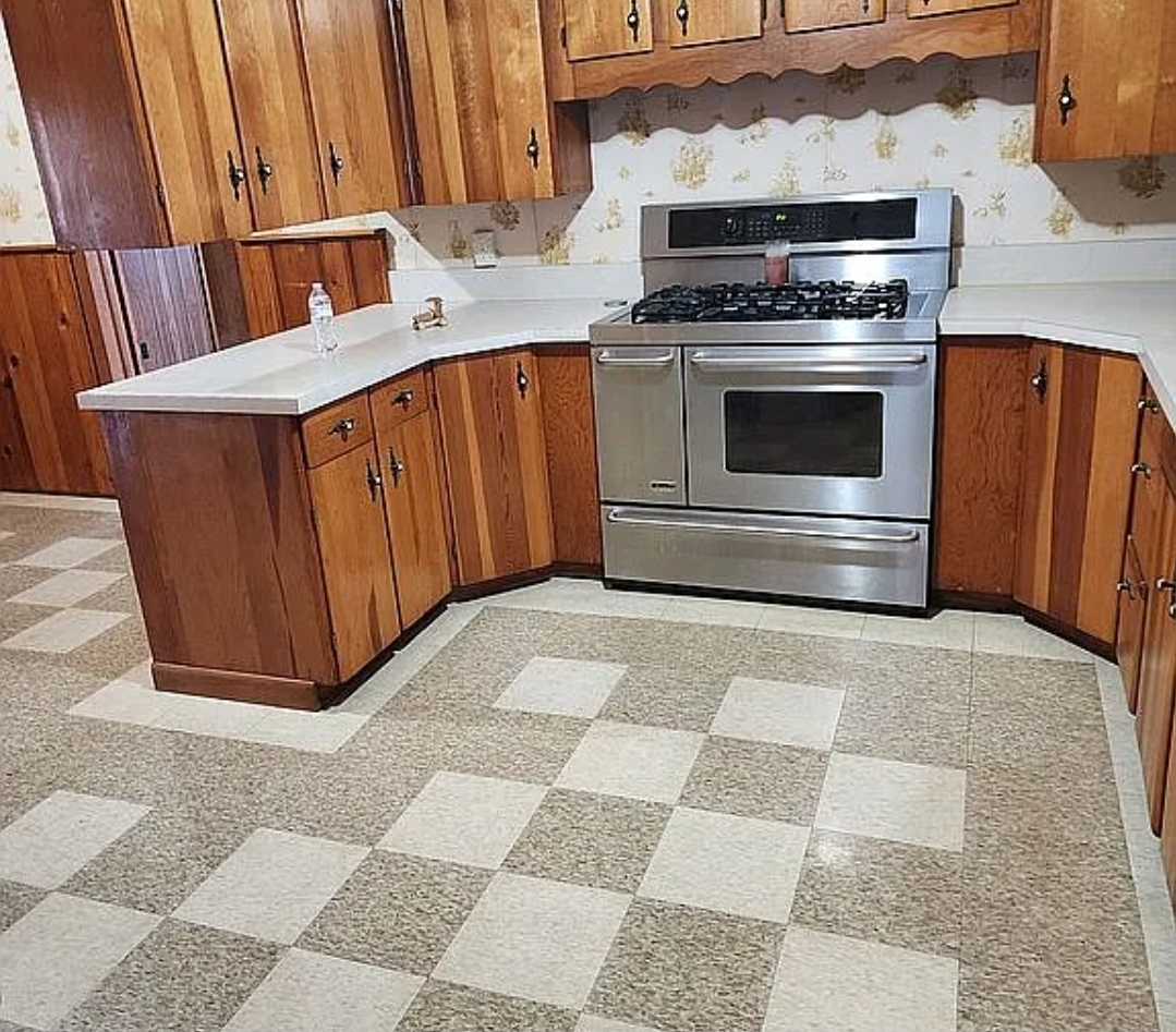 1100 John Stelle Road McLeansboro, IL 62859 - Photo 15 of 20 a kitchen with a stove top oven and cabinets