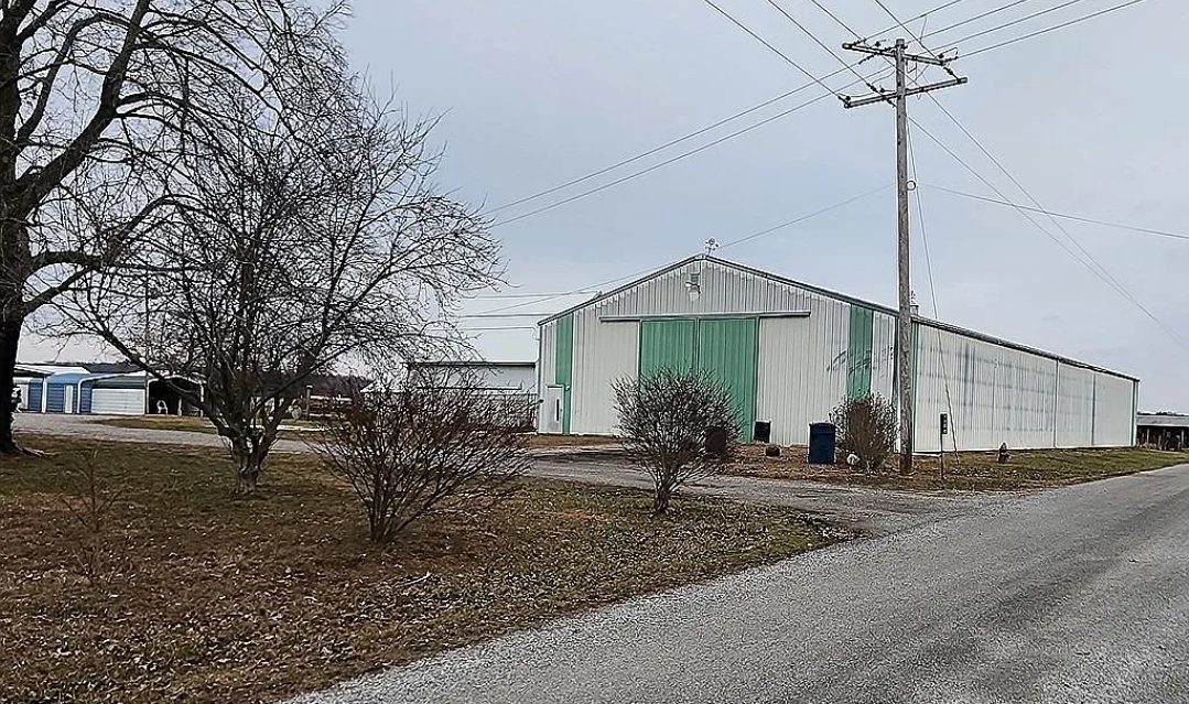 1100 John Stelle Road McLeansboro, IL 62859 - Photo 4 of 20 a front view of a house with a yard and garage
